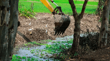 Canal with backhoe
